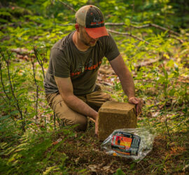 Man places Ani-Protein Block 365 on the ground