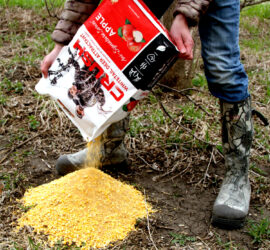 Bag of CRUSH Apple Granular being poured onto the ground