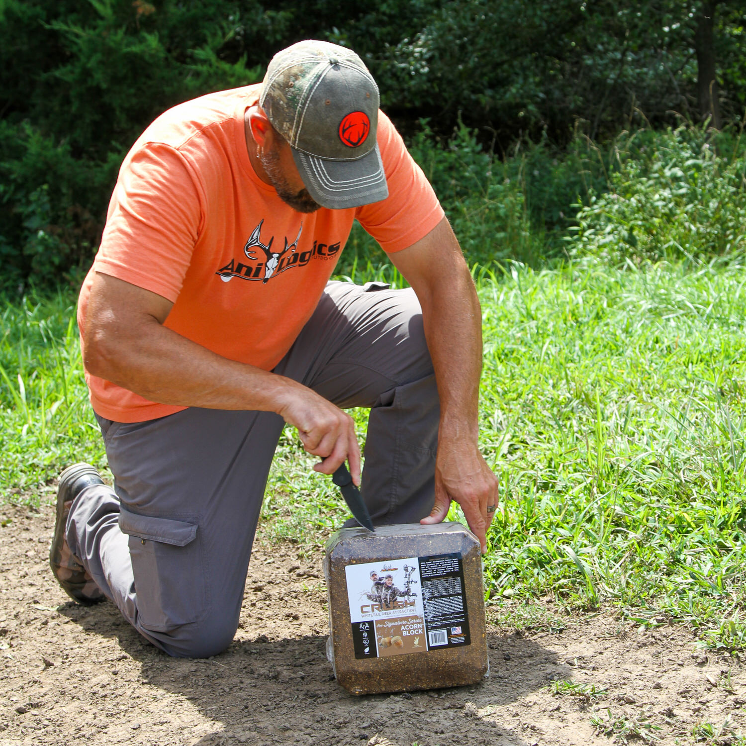 Man taking plastic cover off the CRUSH Acorn Block