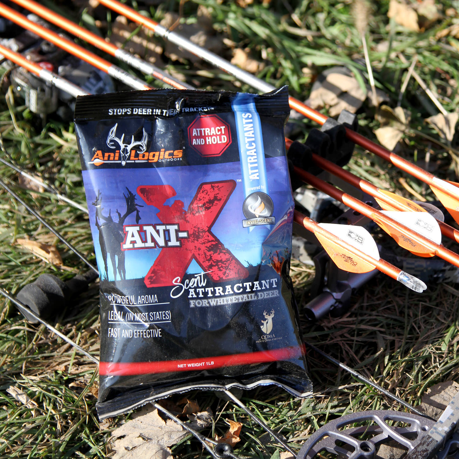 Bag of Ani-X Scent Attractant on the ground next to some arrows