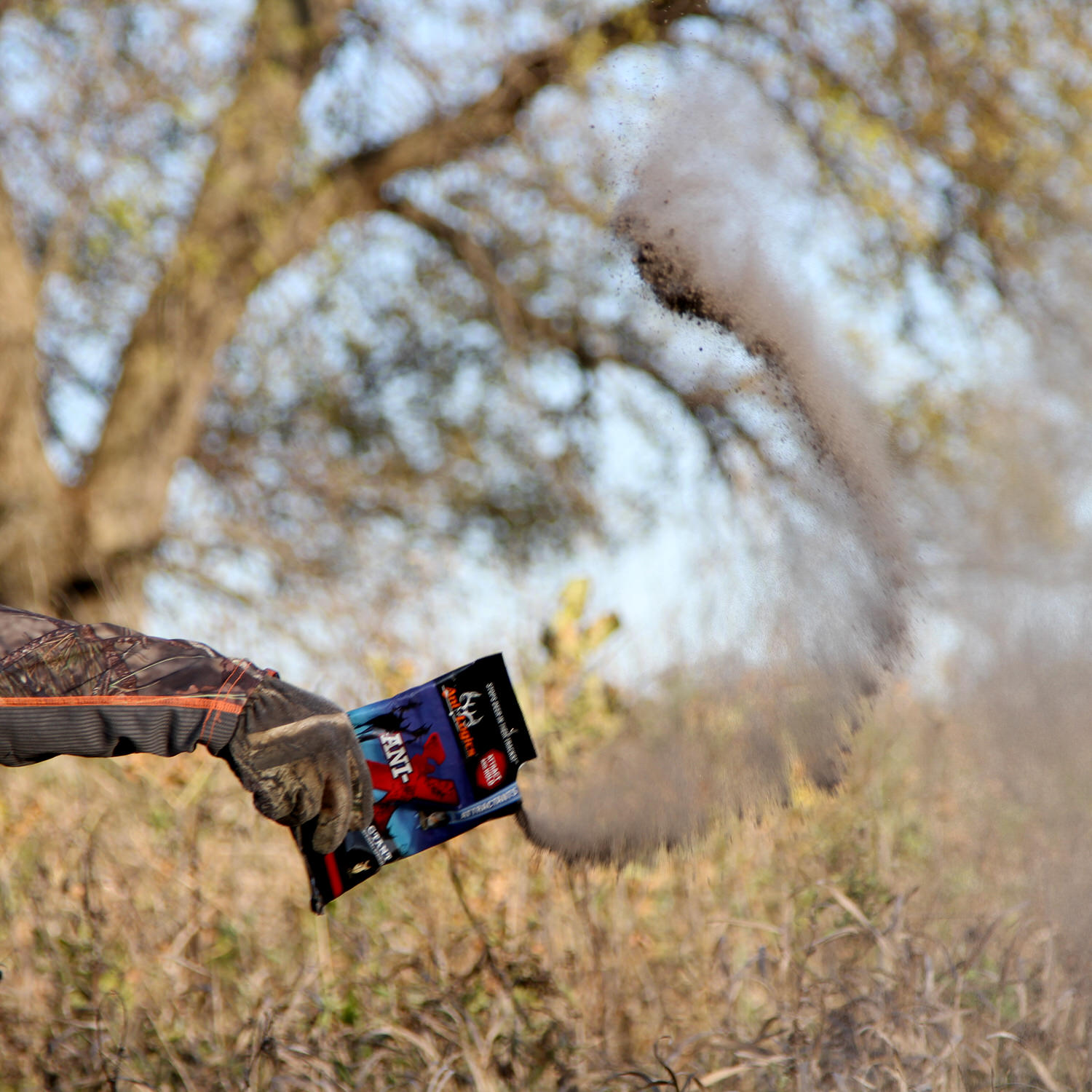 Bag of Ani-X Scent Attractant being spread around the woods