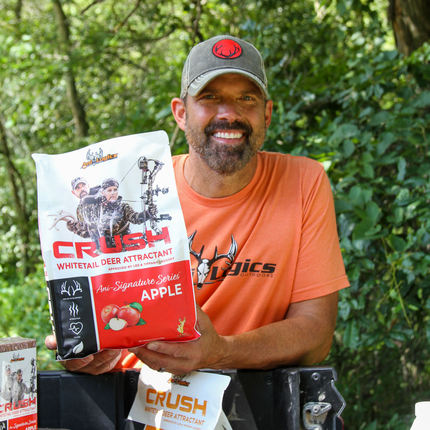 Lee Lakosky holding a bag of CRUSH Apple Granular