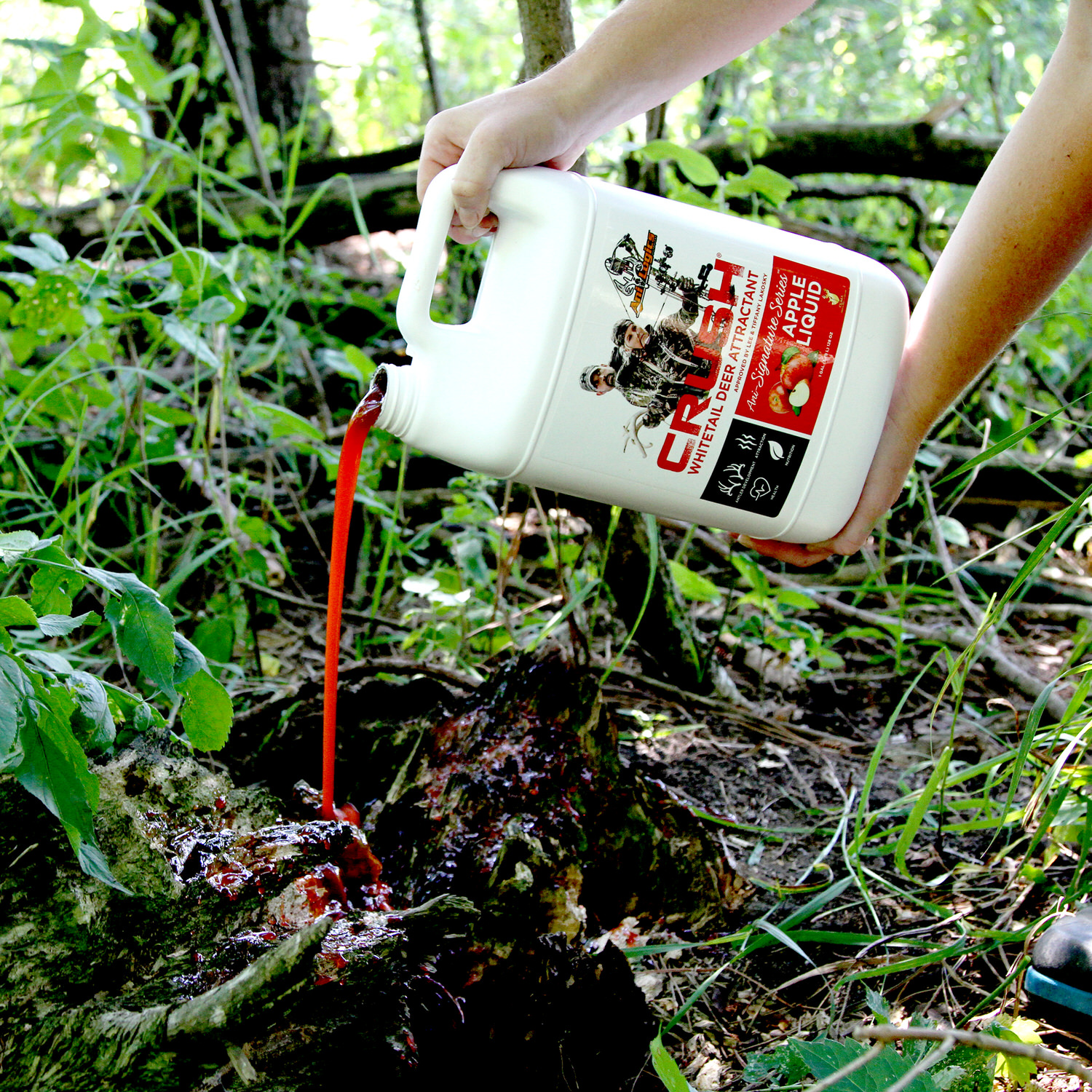 CRUSH Apple Liquid being poured onto a stump