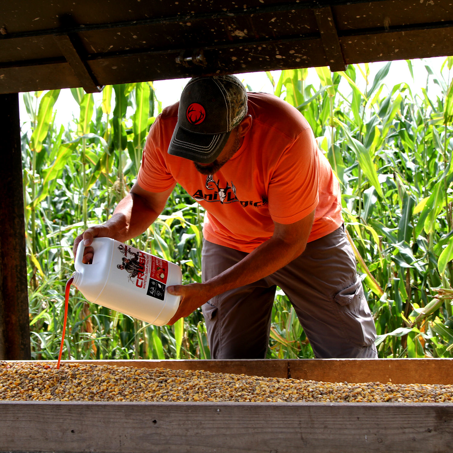 Lee Lakosky pouring CRUSH Apple Liquid into a feed trough