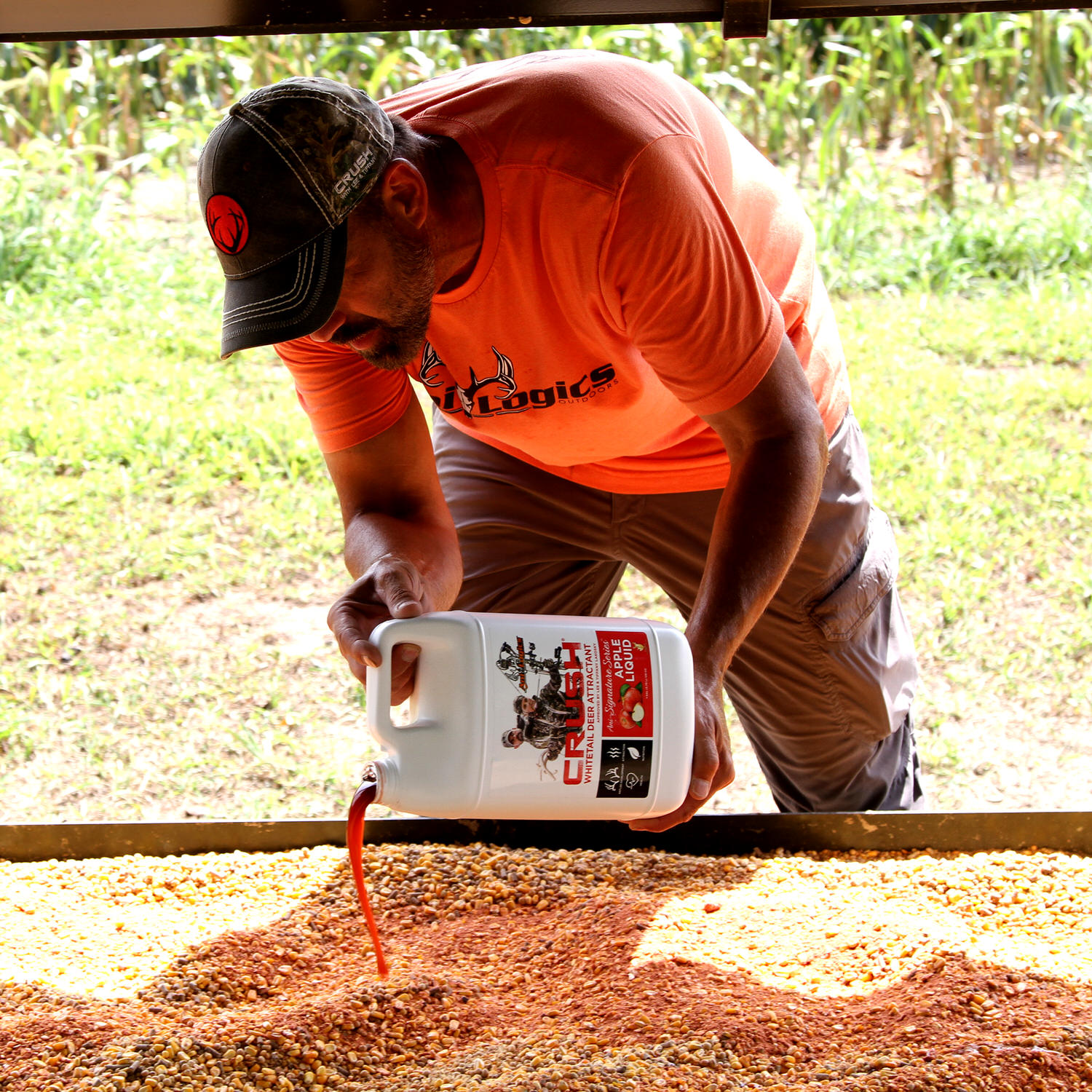 Lee Lakosky pouring CRUSH Apple Liquid into a feed trough