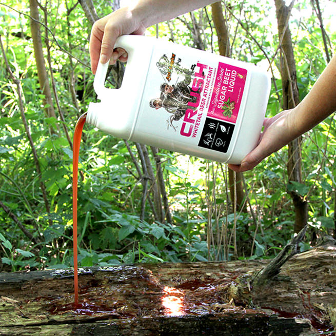 CRUSH Sugar Beet Liquid being poured onto a log