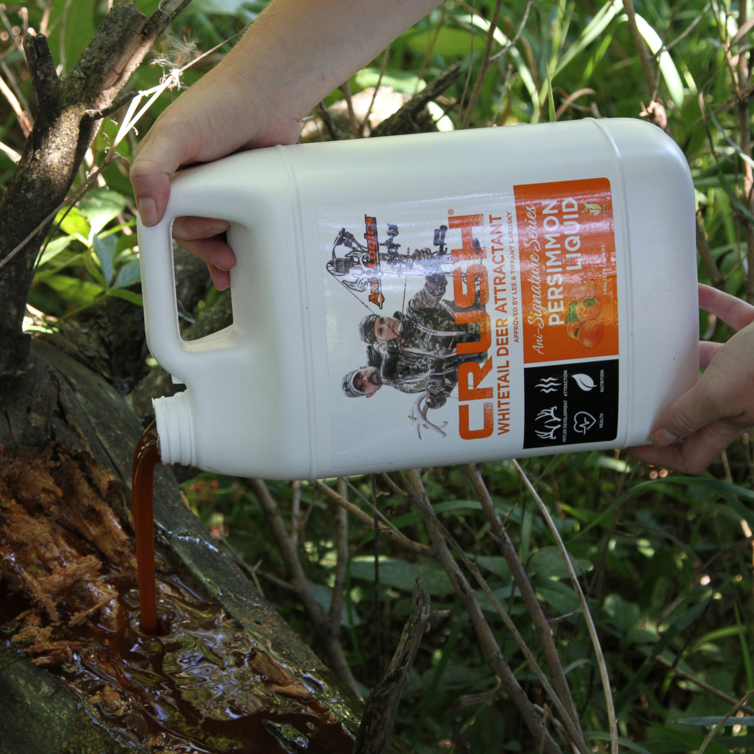 CRUSH Persimmon Liquid being poured onto a log