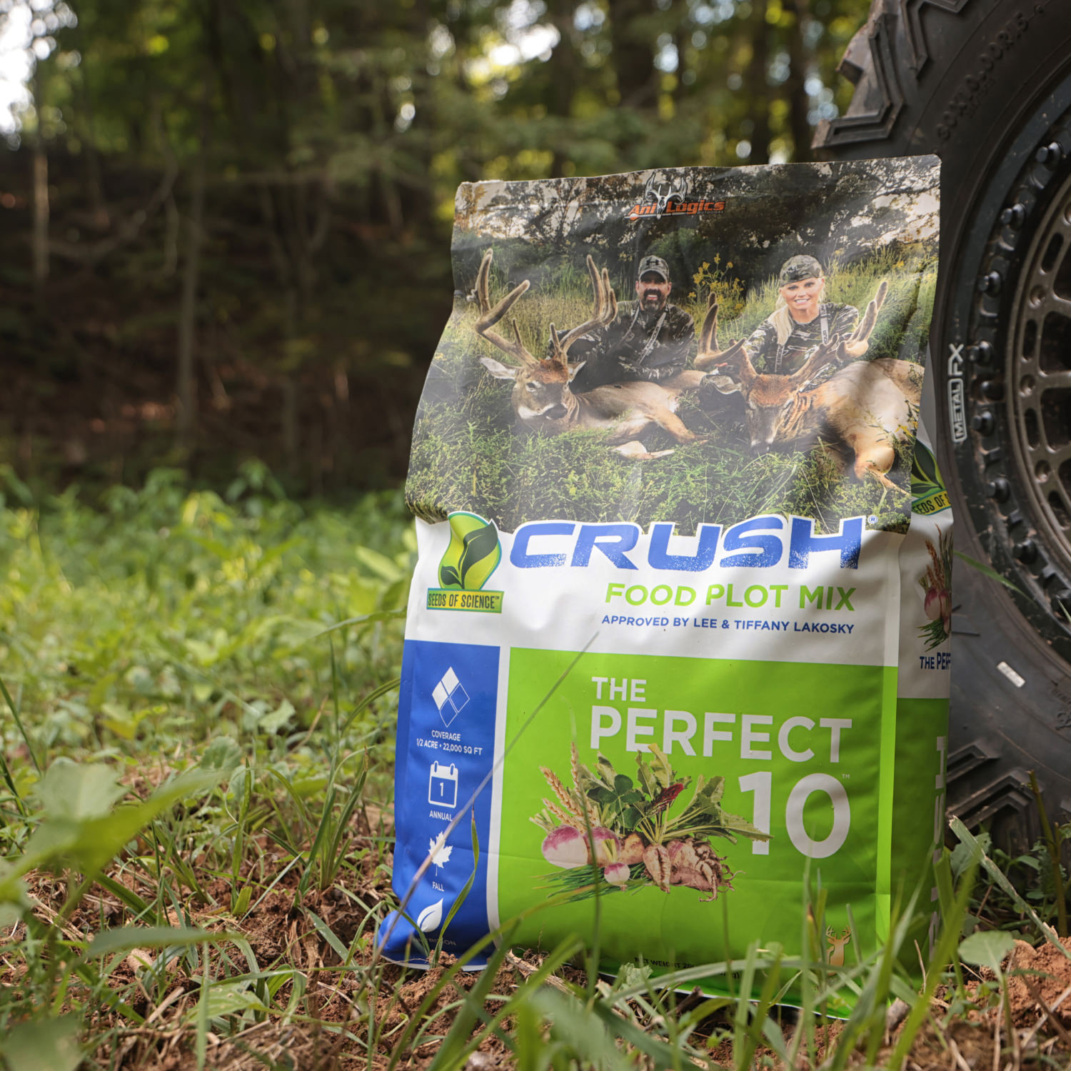 A bag of CRUSH - The Perfect 10 leaning against an ATV tire