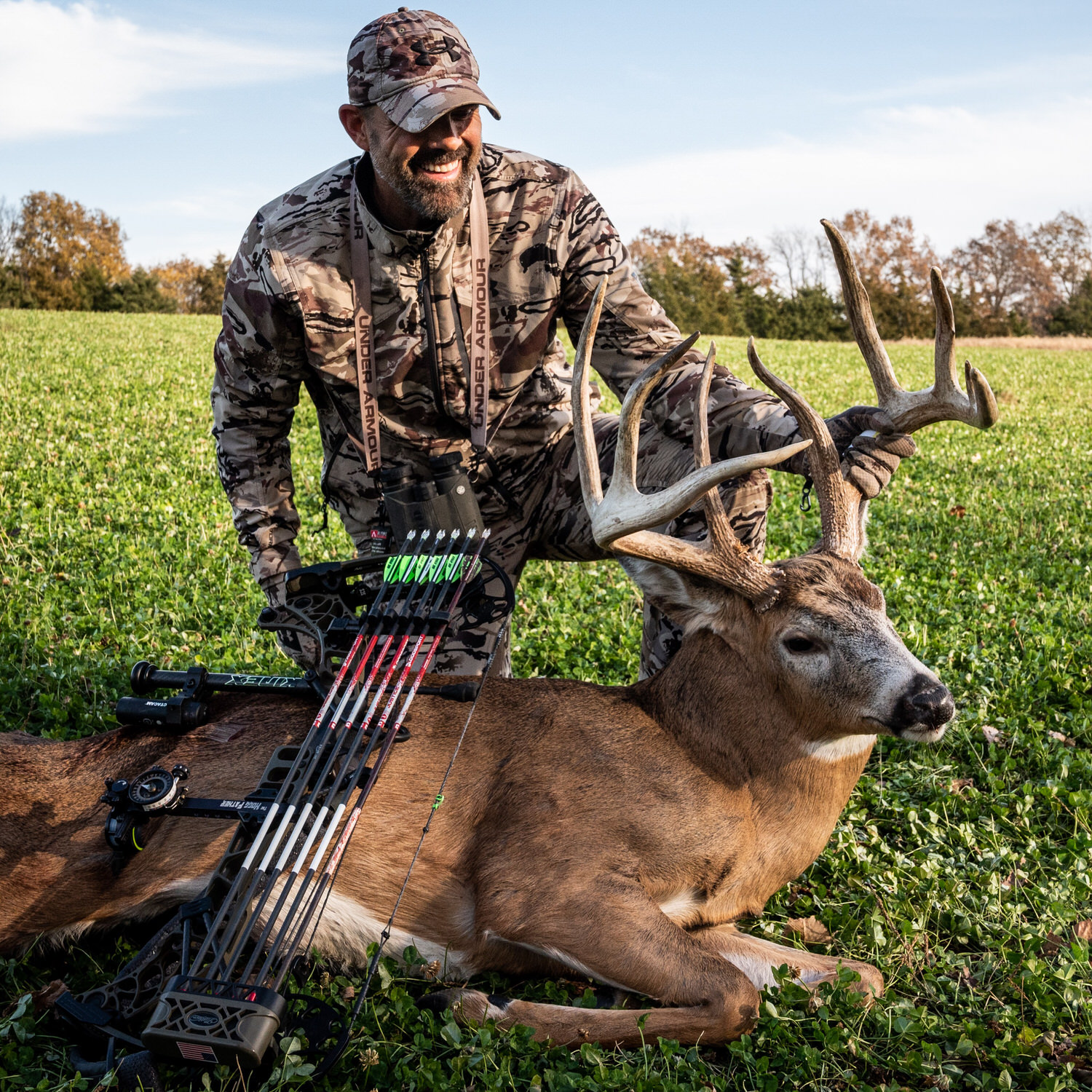 Lee Lakosky posing with deer on a plot planted with Pro Clover