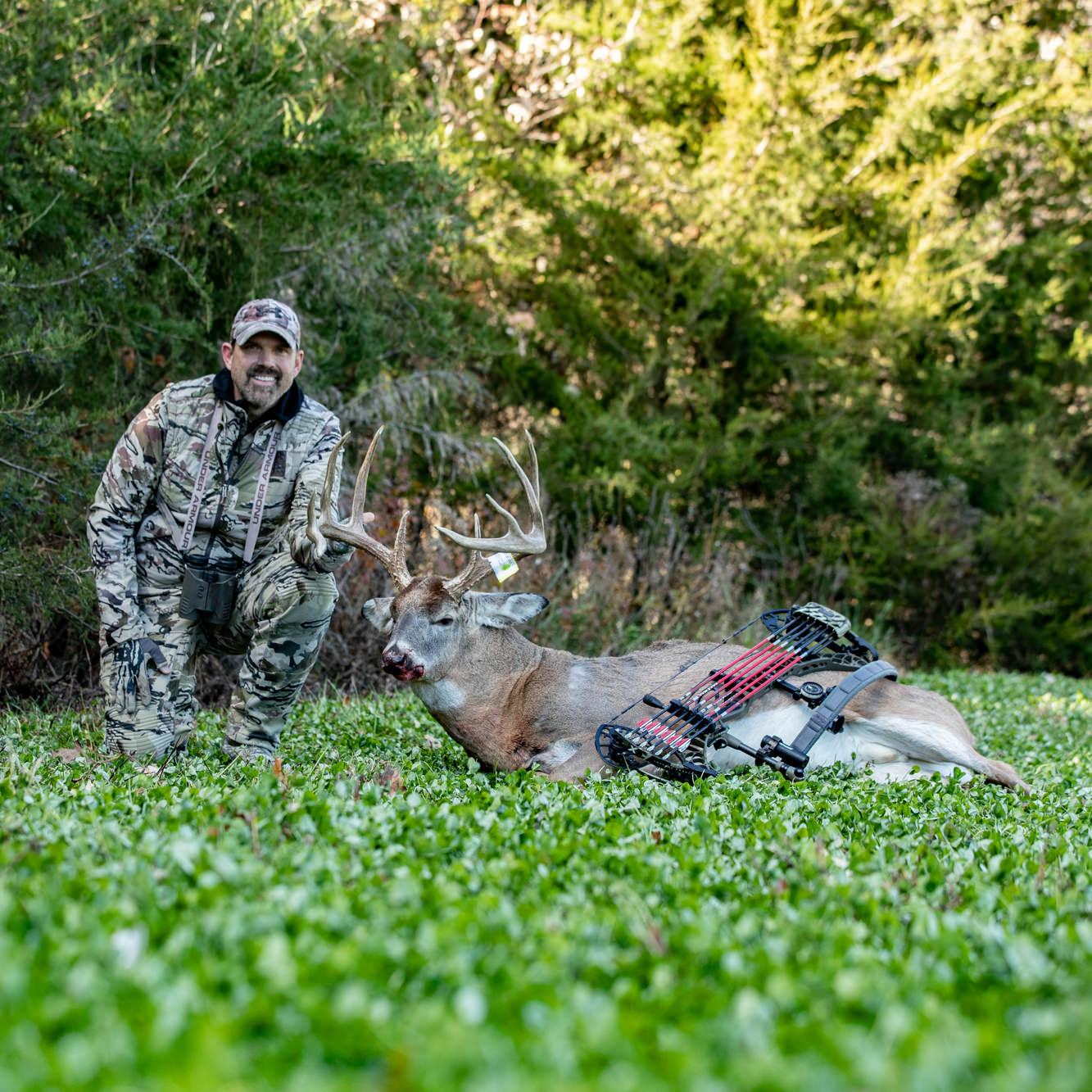 Lee Lakosky posing with buck on a plot planted with Pro Clover