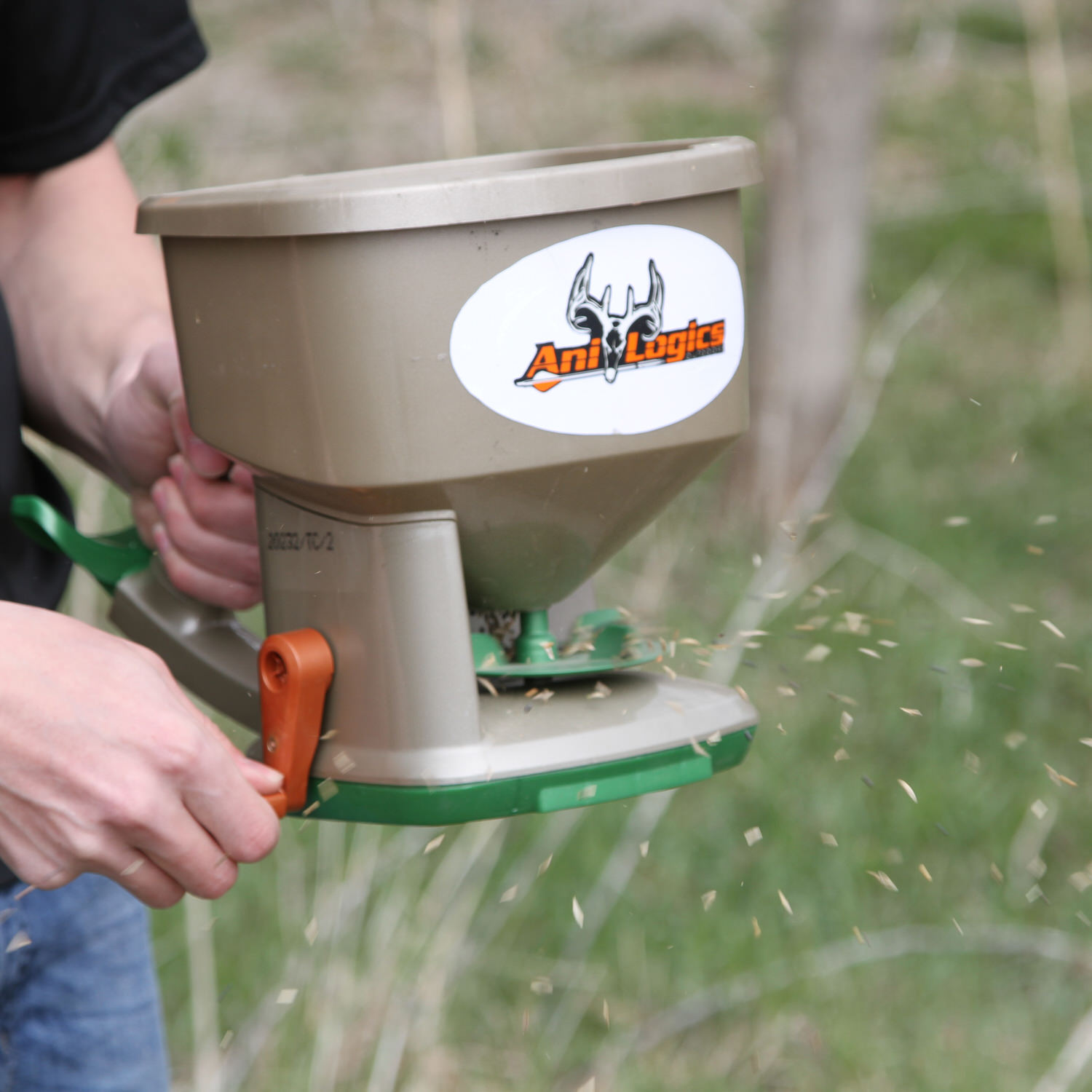 Man broadcasting the Crush Caveman Blend food plot mix