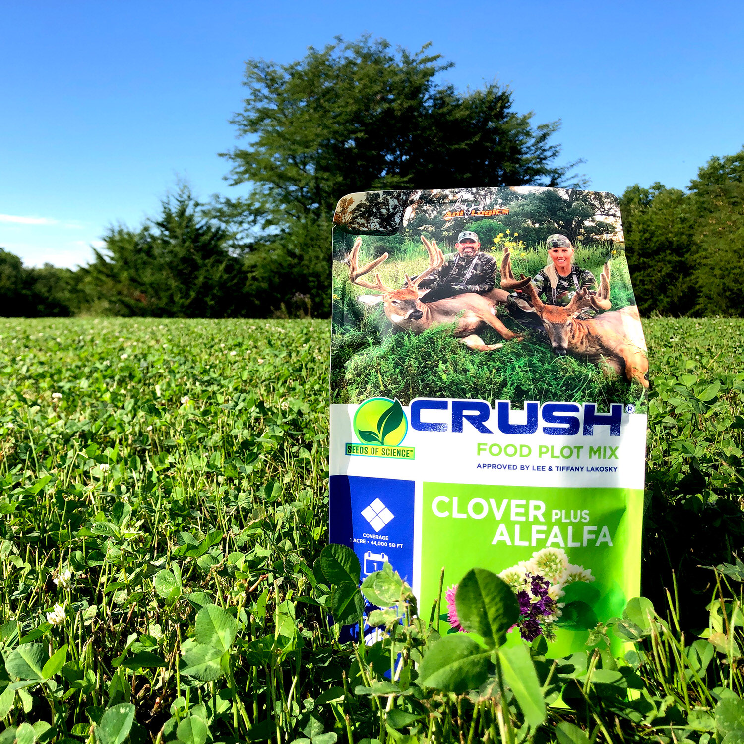 Bag of CRUSH Clover Plus Alfalfa sitting in a food plot