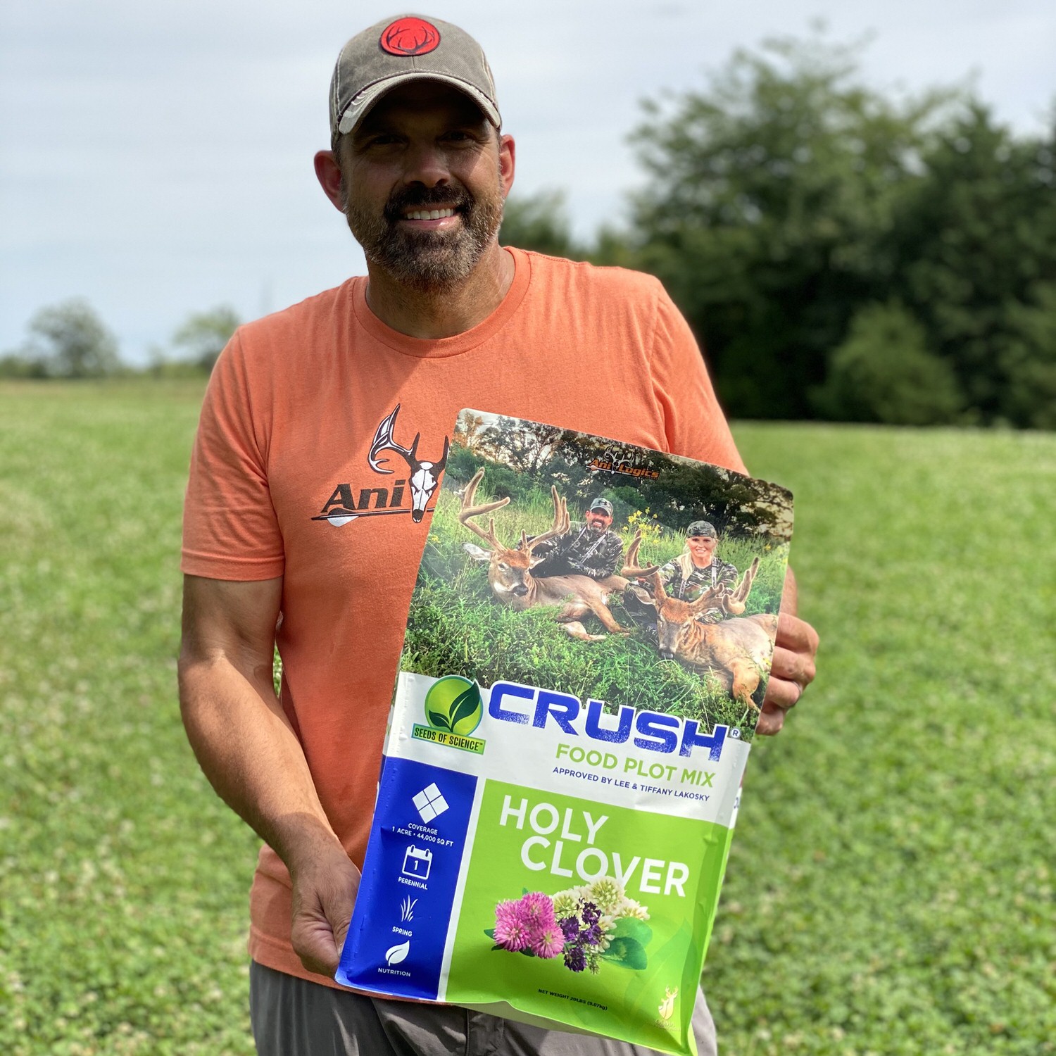 Lee Lakosky holding a bag of CRUSH Holy Clover