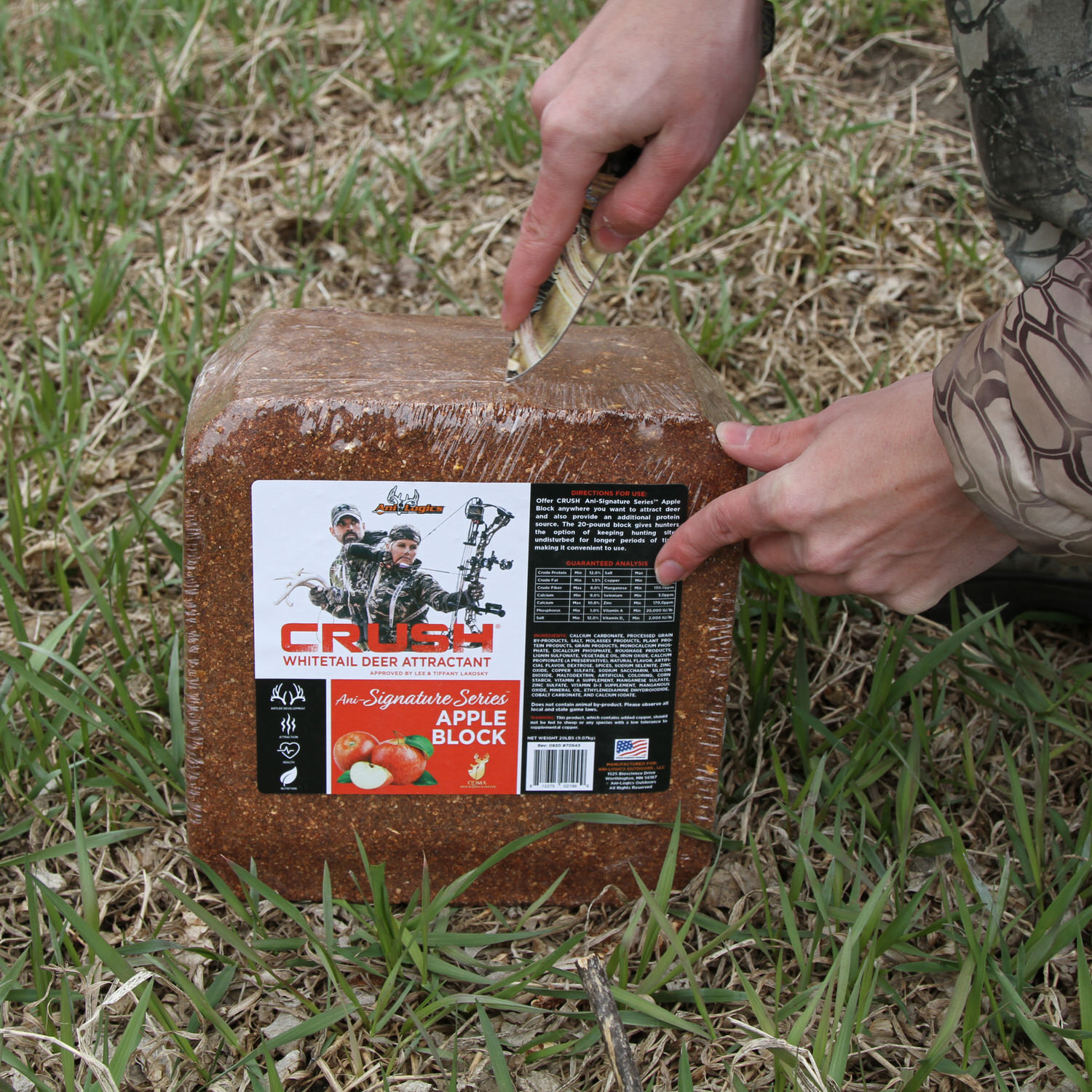 Man using a knife to remove the plastic cover on the the CRUSH Apple Block