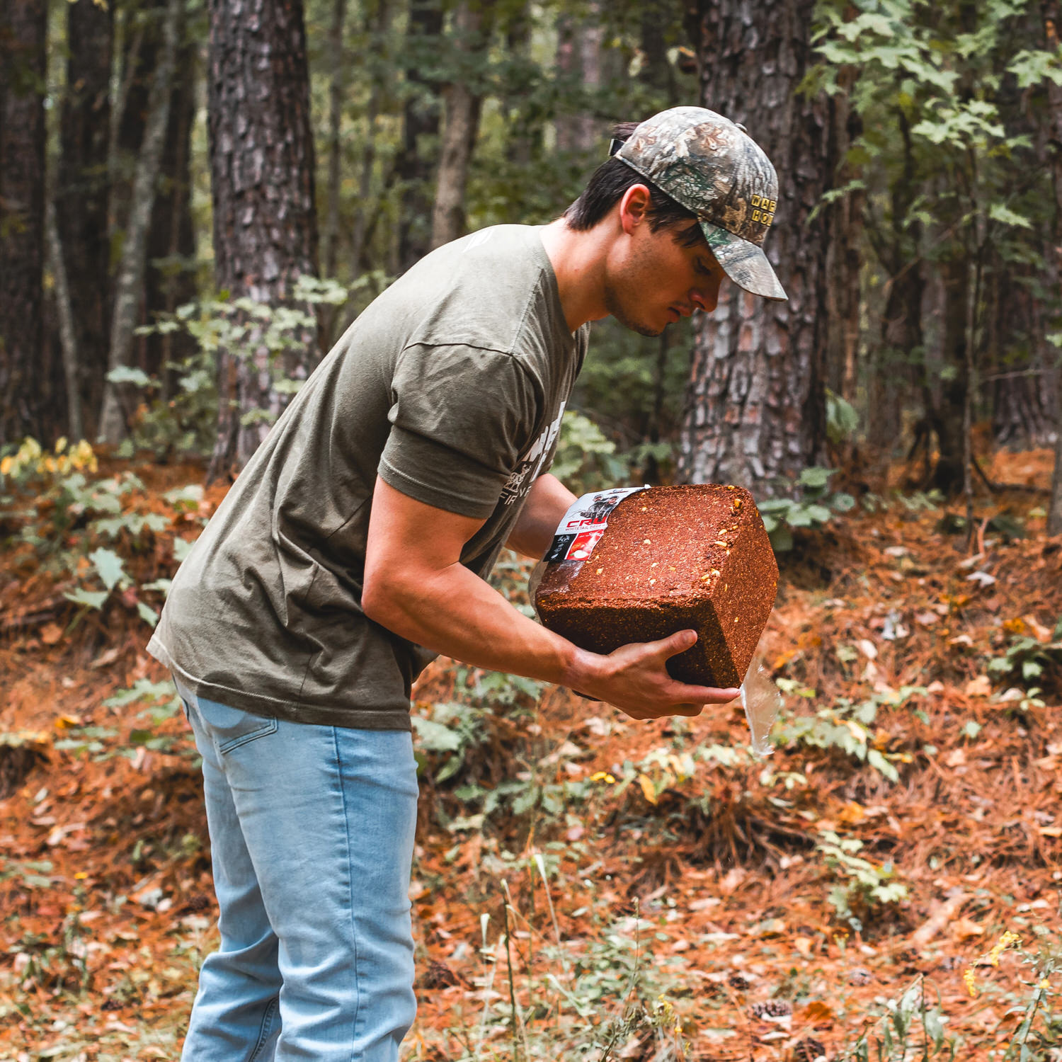 Man getting ready to place a CRUSH Apple Block on the ground