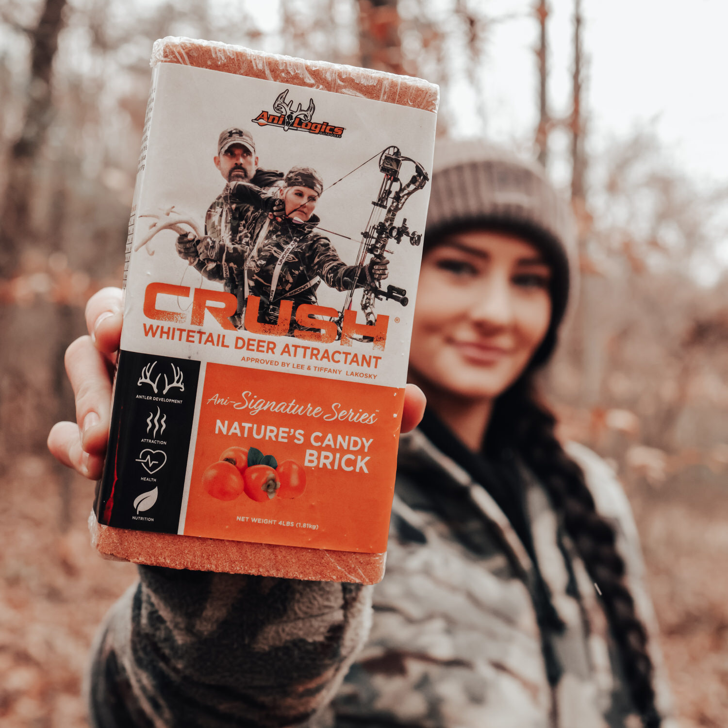 Woman holding up a CRUSH Nature's Candy Brick