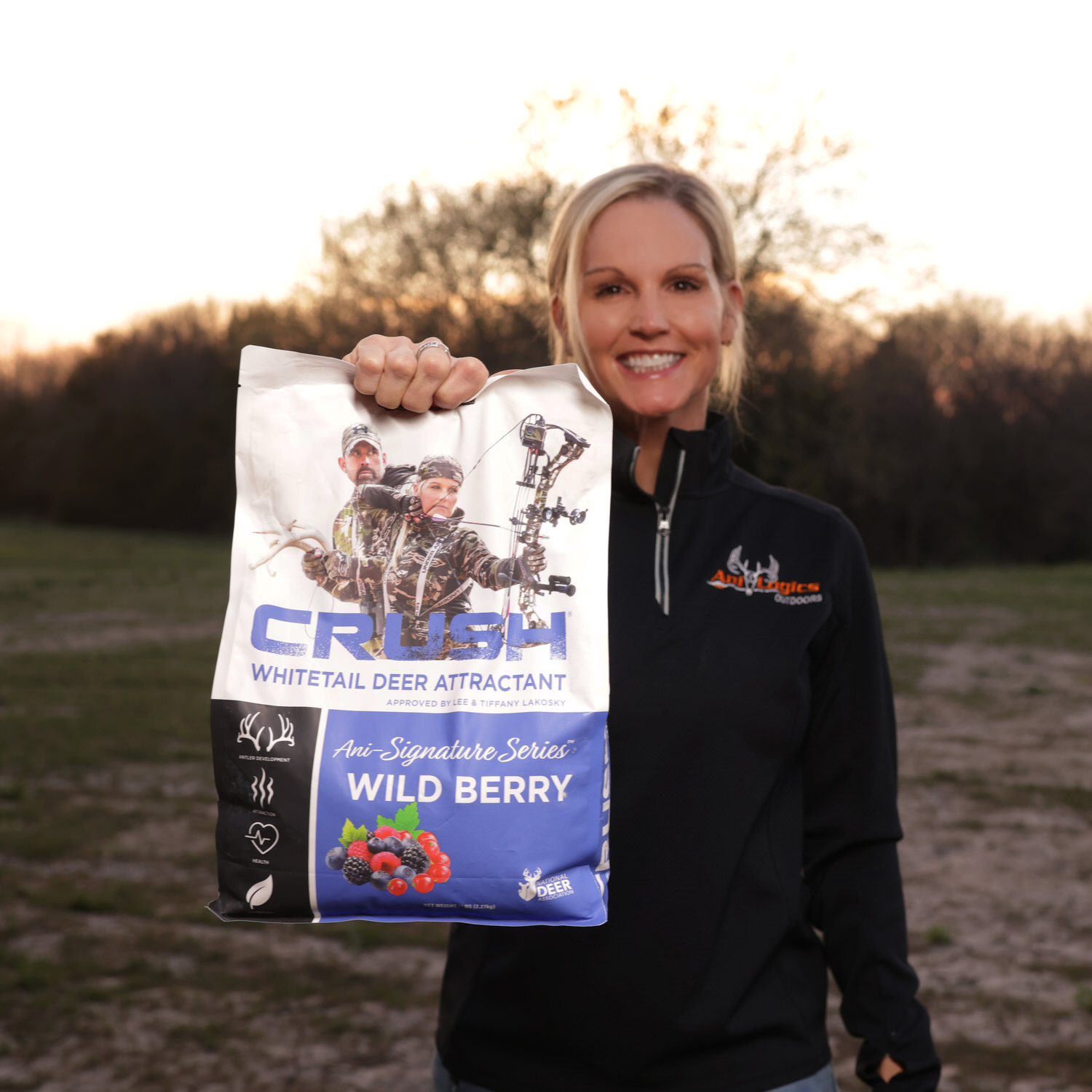 Tiffany Lakosky holding a bag of CRUSH Wild Berry Granular